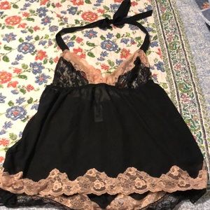 Black babydoll lingerie with black and pink lace.
